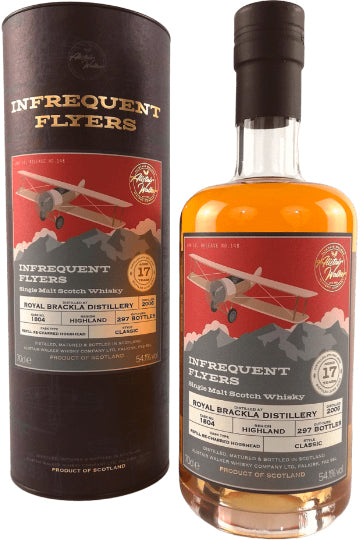 Eine Whiskyflasche und ihre Verpackung der Marke "Infrequent Flyers", auf der ein rotes Flugzeug abgebildet ist.