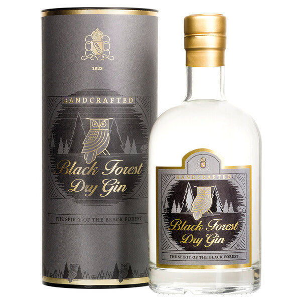 Eine Flasche Black Forest Dry Gin und die dazugehörige Verpackung mit Eulendesign.