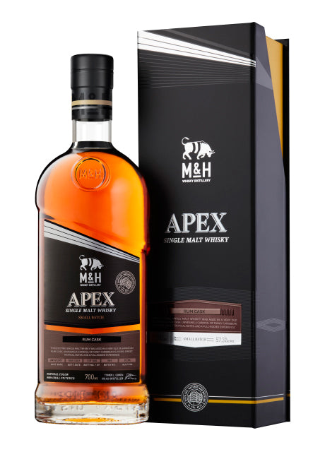 Eine Flasche M&H Apex Single Malt Whisky neben ihrer Verpackung.